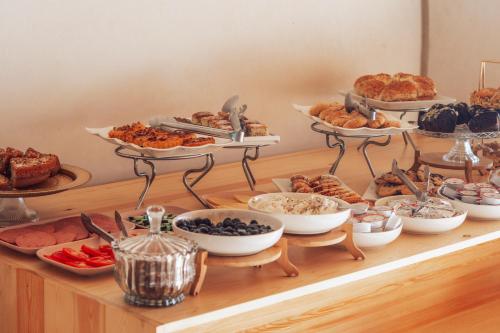 a buffet of food on a table with various pastries at New Spirit Dakhla in Dakhla