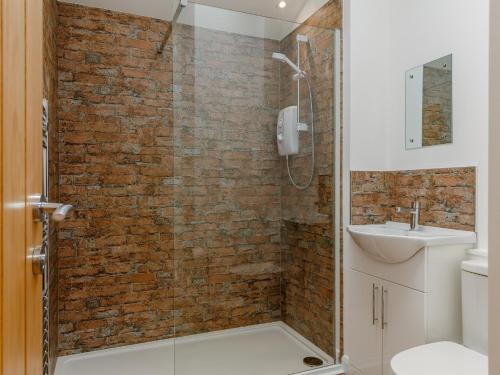 a bathroom with a shower and a sink at 2 Bed in Brixham 78565 in Brixham