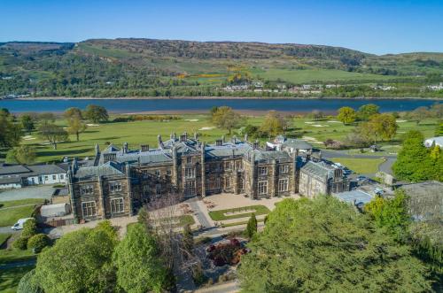 an aerial view of a mansion with a lake at JA Mar Hall Scotland in Bishopton
