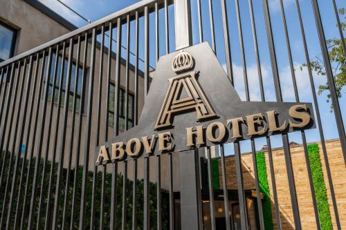 a sign in front of a above hotels building at Above Hotels in Burnley