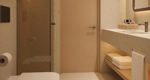 a bathroom with a shower and a toilet and a sink at Port Benidorm Hotel & Spa 4* Sup in Benidorm