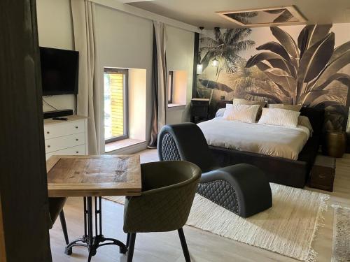 Ένα ή περισσότερα κρεβάτια σε δωμάτιο στο L'Arôme