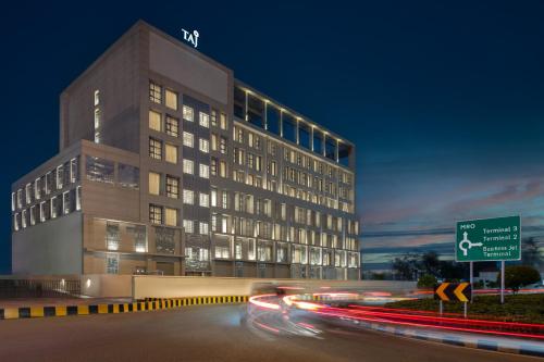 a tall building with a road in front of it at Taj Cochin International Airport, Kerala in Cochin