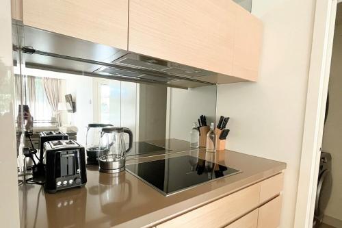 a kitchen with a counter top with a blender at Docklands Luxury Comfort Apartment in Melbourne