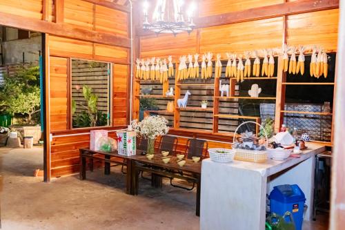 a room with a table with baskets and utensils at The Monhi Da Lat City in Xuan An