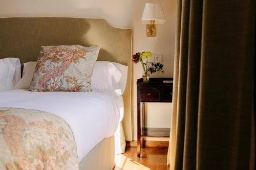Postel nebo postele na pokoji v ubytování Hotel PAX Casona del Busto