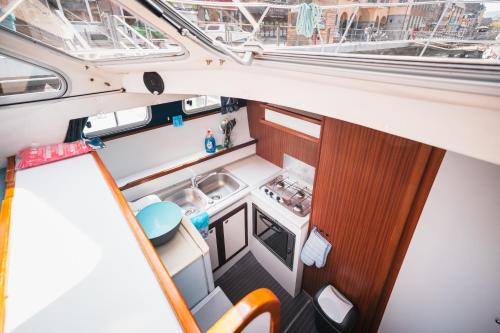 an overhead view of a small kitchen in a boat at Pénichettes Dinant Evasion in Dinant