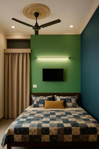 a bedroom with a bed with a green wall at radhe ji homestay AC or non ac in Ayodhya