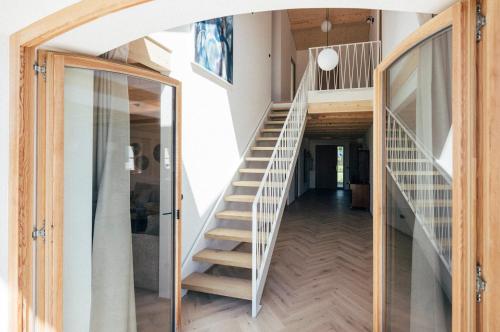 a staircase leading to the second floor of a house at Das Frialing in Altenmarkt an der Alz