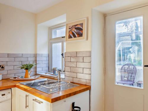 a kitchen with a sink and a window at 2 Bed in Grassington 93941 in Hebden
