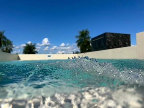 a splash of water in a swimming pool at SASH-Resort in San Juan del Paraná
