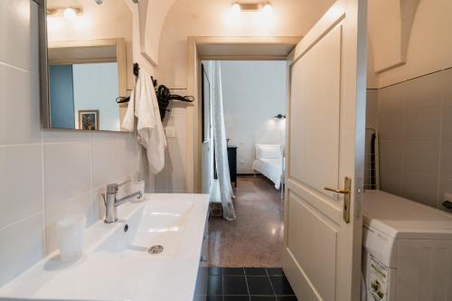 a bathroom with a sink and a mirror at CASA PAPADIA in Uggiano la Chiesa