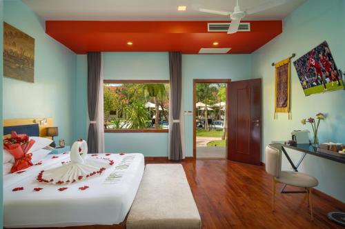 Postel nebo postele na pokoji v ubytování Sala Siem Reap Resort