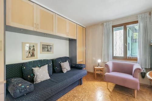 a living room with a couch and a chair at Casa Andy 1 Val Lavizzara - Happy Rentals in Al Piano