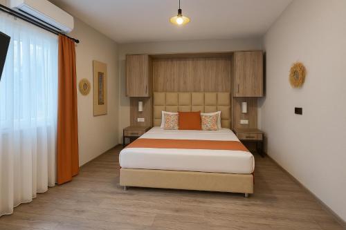 a bedroom with a large bed in a room at Hotel Centro Bodrum in Bodrum City