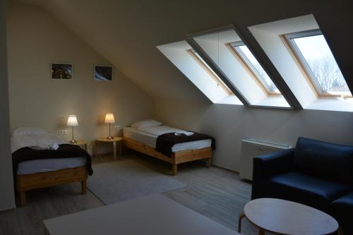 Ένα ή περισσότερα κρεβάτια σε δωμάτιο στο Elixbeer Kastély Sörház és Vendégház