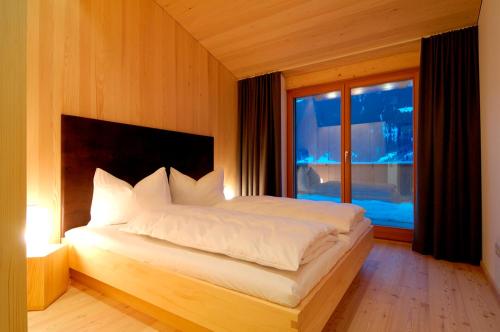 Una cama o camas en una habitación de Montafon Chalets