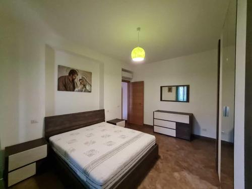 a bedroom with a large bed in a room at DUE PASSI dal MARE in Cittadella del Capo