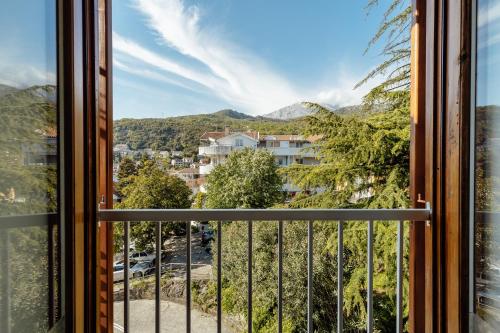 a window with a view of a city at Depadans Hotela TALIA in Igalo