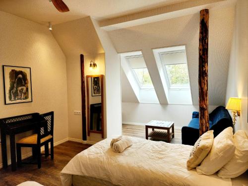 a bedroom with a large bed and a window at Mia Hotel in Orissaare