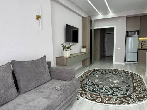 Una televisión o centro de entretenimiento en Cozy Apartment