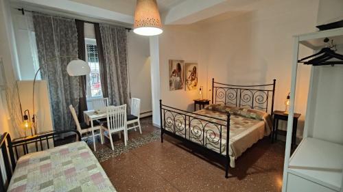 a bedroom with a bed and a table and chairs at AL171 Tourist Rental close Metro B1 - Sant'Agnese Annibaliano in Rome