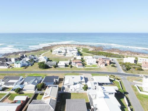 an aerial view of houses and the ocean at Simplicity 2 in Agulhas
