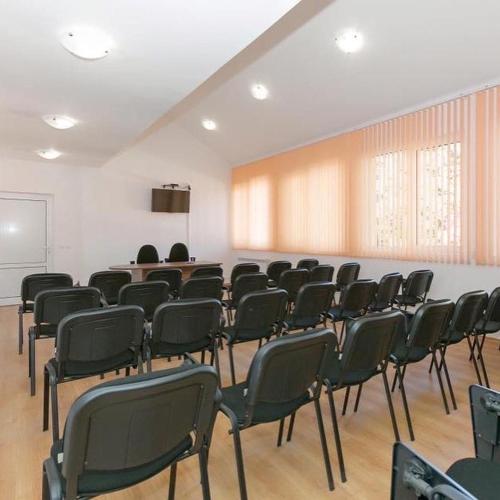 a room with a bunch of chairs in a room at Вилно селище Тракия- почивка сред природата in Tsigov Chark