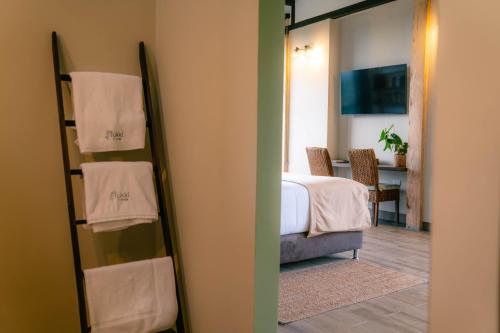 Tukki Ecolodge Hotelにあるベッド