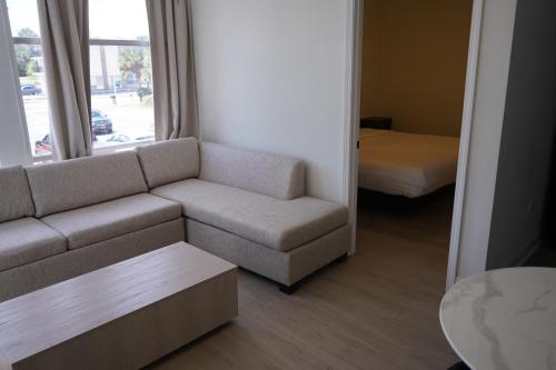 a living room with a couch and a bed at Indigo in Myrtle Beach