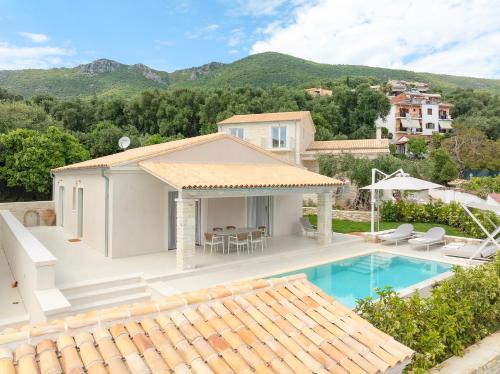 an aerial view of a house with a swimming pool at Parga Villas in Parga