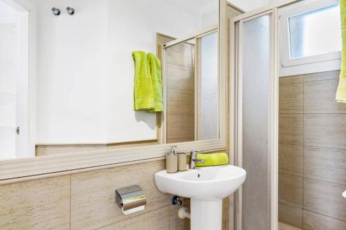 a bathroom with a sink and a mirror at Villa Amara by Villa Plus in Chayofa