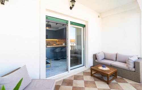 a living room with a couch and a table at 1 Bedroom Nice Apartment In Hvar in Hvar