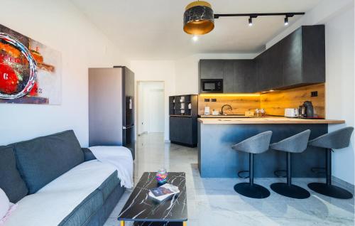 a living room with a couch and a kitchen at 1 Bedroom Nice Apartment In Hvar in Hvar
