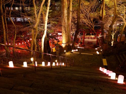 a group of candles on the stairs at night at 多武峰観光ホテル in Sakurai