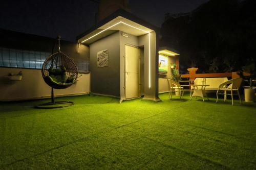 a house with a green light in a yard at Gorai Villa - Gagal Home in Mumbai