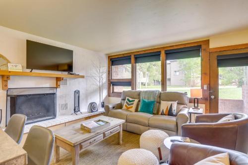 a living room with a couch and a fireplace at Eagle-Vail Hideaway with Golf, Ski, and More! in Vail