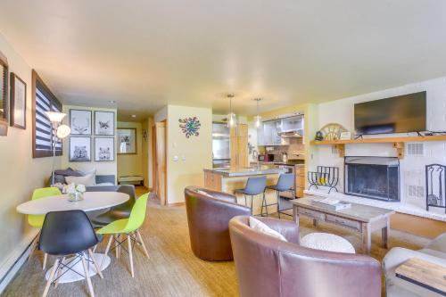 a living room with a table and chairs and a kitchen at Eagle-Vail Hideaway with Golf, Ski, and More! in Vail