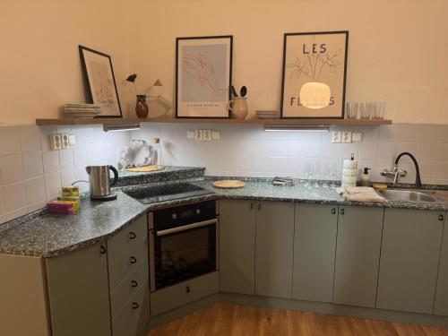 a kitchen with granite counter tops and a sink at Kampus Palace in Ostrava