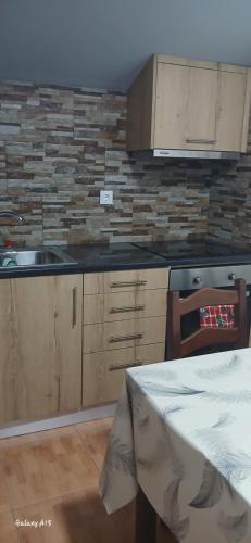 a kitchen with a sink and a counter top at Ferradosa GuestHouse in São João da Pesqueira