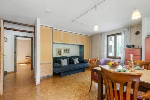 a living room with a couch and a table at Casa Andy 2 Val Lavizzara - Happy Rentals in Al Piano