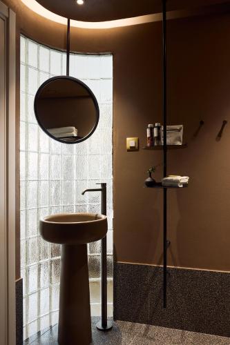 a bathroom with a sink and a mirror at A for Athens in Athens