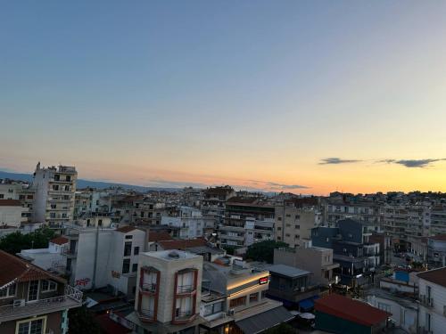 a view of a city at sunset at Sunny apartment 1 in Serres