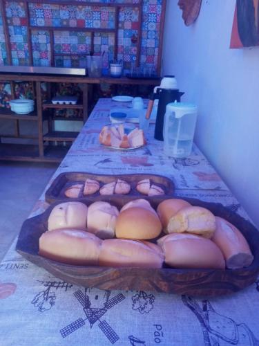 a table with a bunch of buns on it at EBORA Afro Cultural in Ilhéus