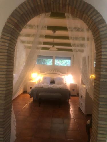 Postel nebo postele na pokoji v ubytování Cortijo de Mariangela DOS