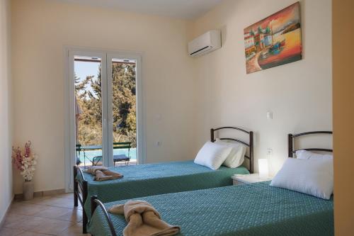 Ένα ή περισσότερα κρεβάτια σε δωμάτιο στο Villa Iremia