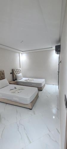 Postel nebo postele na pokoji v ubytování appartment igar azougagh elhoceima