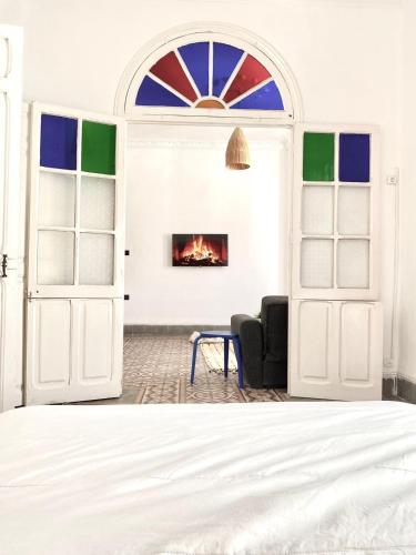a room with an open door with a fireplace at 2 COZ'S apartments central Medina Tetuan in Tetouan