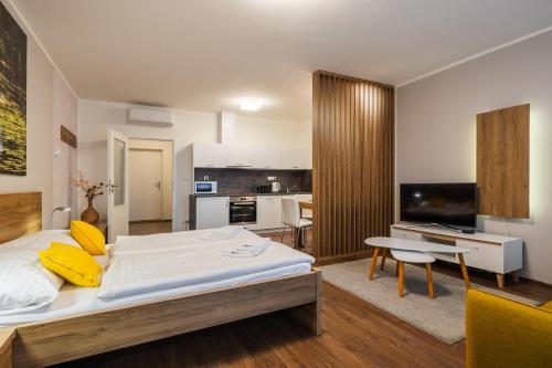Postel nebo postele na pokoji v ubytování Apartmány Viva Třeboň