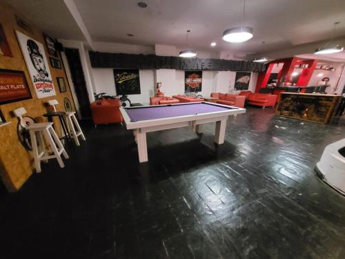 a room with a ping pong table in it at Santa Rosa Hotel in Olavarría